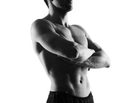 Handsome man with crossed arm on white background