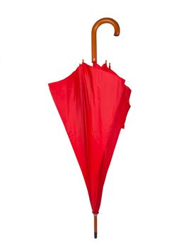 Closed red umbrella isolated on white background