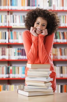 Portrait of smiling female student in library