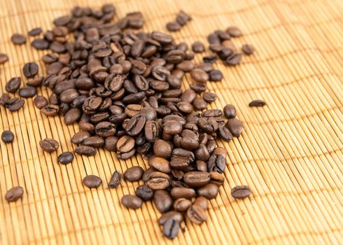 Coffee grains on a bamboo rug