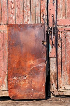 old wooden door with iron -coated and lock