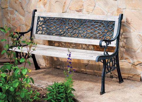 Old empty wooden bench in a village orchard