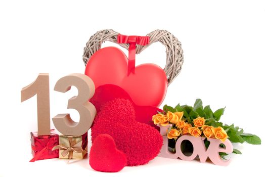 Number of age in a colorful studio setting with heart and gifts and yellow roses