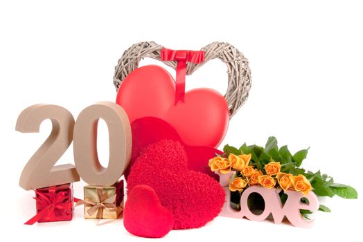 Number of age in a colorful studio setting with heart and gifts and yellow roses