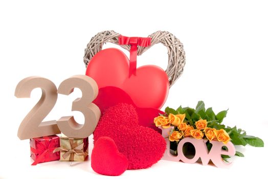 Number of age in a colorful studio setting with heart and gifts and yellow roses