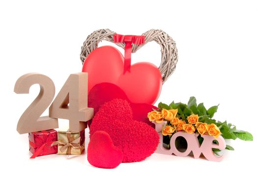 Number of age in a colorful studio setting with heart and gifts and yellow roses