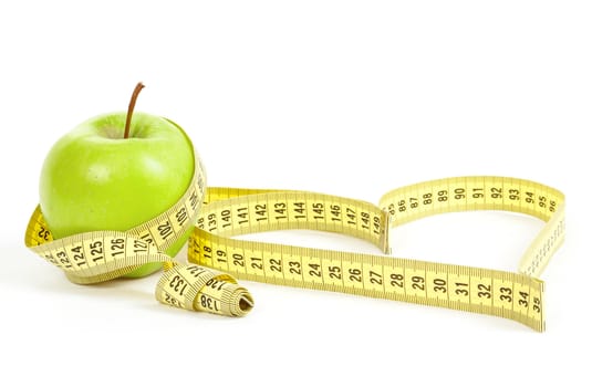 green apple with a measuring tape and heart symbol isolated on white background 