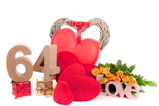 Number of age in a colorful studio setting with heart and gifts and yellow roses