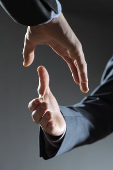 Two business men shaking hands, close up