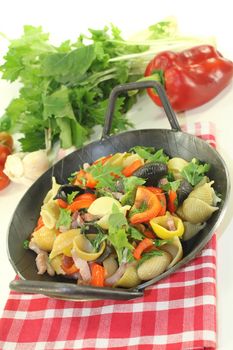 Pasta pan with bell pepper, turnip greens, ham strips, tomatoes and garlic