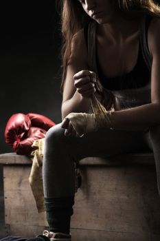 Woman boxer wearing white strap on wrist