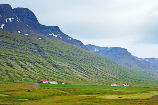 Beautiful Icelandic Landscapes with mountains and houses