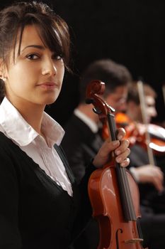 Classical music concert: Portrait of young woman violinist