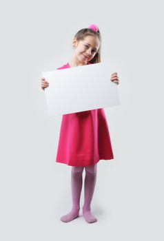 A little girl holds a blank sign, ready for your text