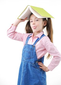 Cute girl with book on her head, white background
