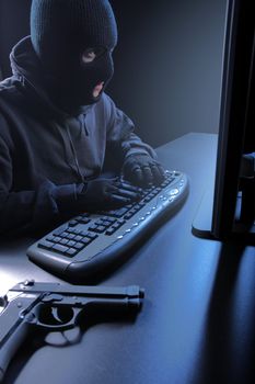 Computer hacker - Male thief stealing data from laptop