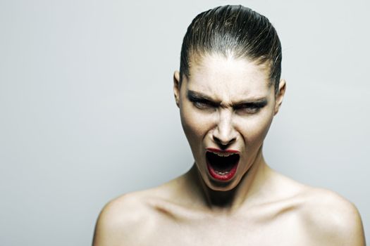 Beautiful woman shouting angry, copy space