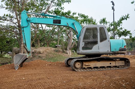 Excavators are heavy construction equipment consisting of a boom, bucket and cab on a rotating platform.
