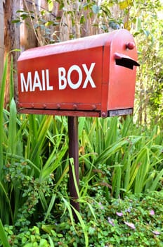 red mail box in the garden
