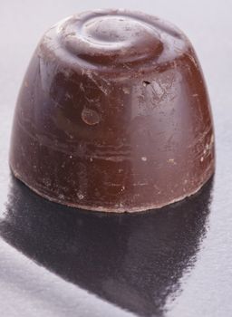 Close up of a little chocolate with reflection