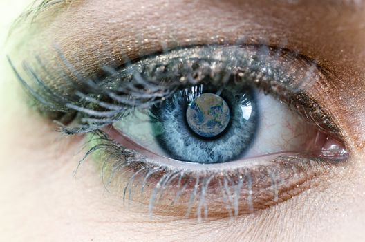 Blue Eye of Woman with Planet Earth, parts of this image furnished by NASA