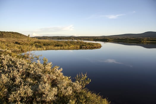 landscape of blue sky and lake