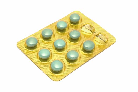 Package of green pills isolated on white background 
