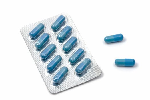 Blue capsules isolated on white background