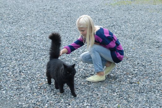 Girl and black cat