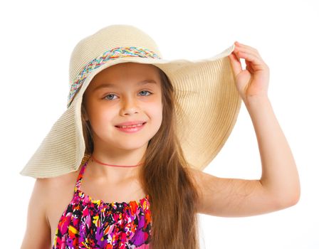 Fashion cute girl in a big hat in the studio