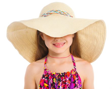 Fashion cute girl in a big hat in the studio
