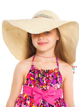 Fashion cute girl in a big hat in the studio