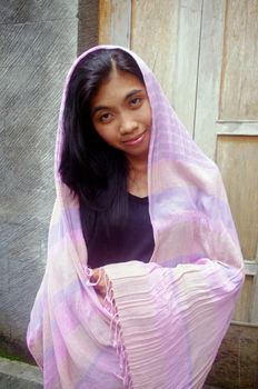 Young Asian woman wearing veil.