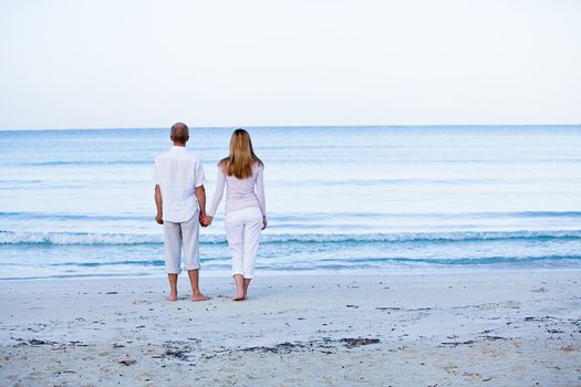 happy young couple in love having fun on the beach blue sky and sunshine 