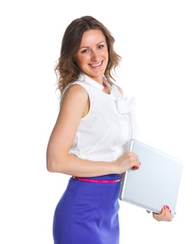 Portrait of a happy young business woman standing with notebook against white background