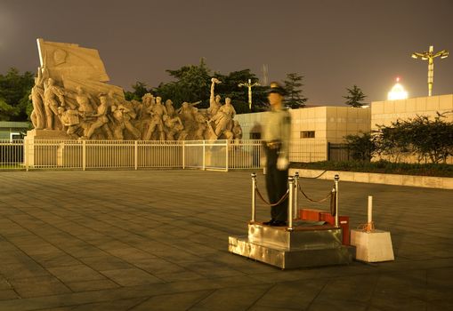 Mao Statue in Front of Mao Tomb Tianamen Square Beijing China with Policeman.