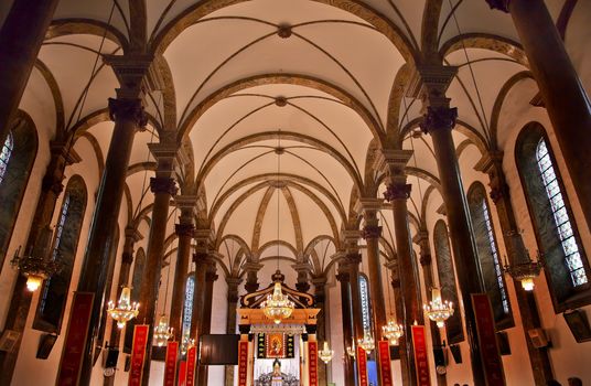 St. Joseph Wangfujing Cathedral, Basilica, Interior Church Beijing China.  Very famous Catholic Church built in 1655 and in Boxer Rebellion 
Chinese Character signs are Christian sayings in Chinese