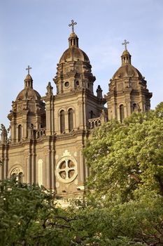 St. Joseph Wangfujing Cathedral, Basilica, Facade Green Trees Church Beijing China.  Very famous Catholic Church built in 1655 and in Boxer Rebellion