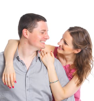 Portrait of a beautiful young happy smiling couple. Isolated white backround