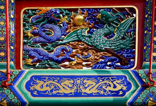 Dragon Phoenix Details Gate Yonghegong Buddhist Temple Beijing China  
Dragon is the symbol of the Emperor, and Phoenix is the symbol of the Empress of China.