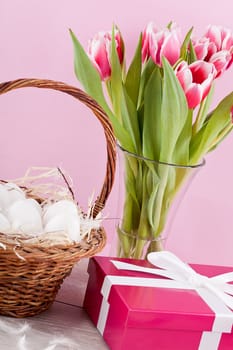 pink present with ribbon and colorful tulips festive easter decoration