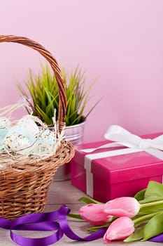 pink present with ribbon and colorful tulips festive easter decoration