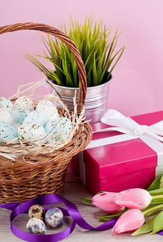 pink present with ribbon and colorful tulips festive easter decoration