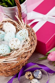 pink present with ribbon and colorful tulips festive easter decoration