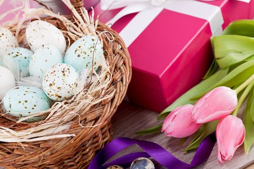 pink present with ribbon and colorful tulips festive easter decoration