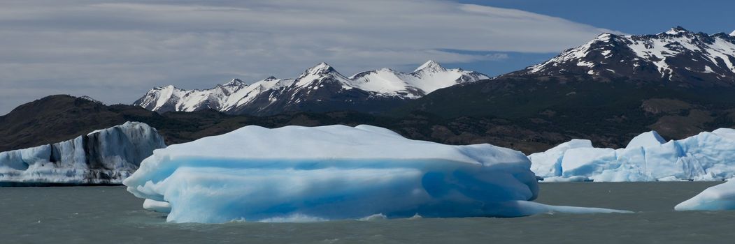 Spectacular blue iceberg floating on the Lake Argentino in the Los Glaciares National Park, Patagonia, Argentina.
