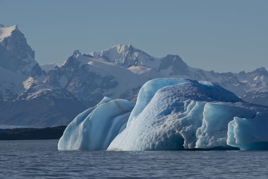 Spectacular blue iceberg floating on the Lake Argentino in the Los Glaciares National Park, Patagonia, Argentina.