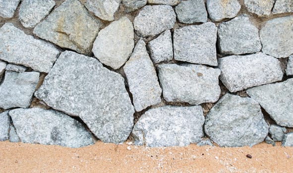 Solid stone wall along the sea beach, Pattaya.