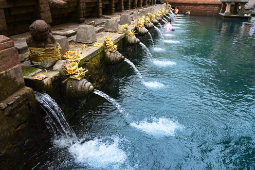 Holy spring water in Tirta Empul temple, Bali, Indonesia 