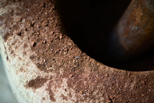 Traditional mortar for coffee beans crumbling up, with shallow depth of field